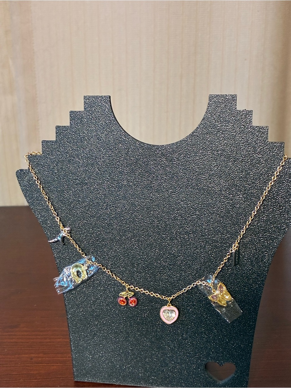 Coach Gold-Tone Charm Necklace with Red and Pink Accents